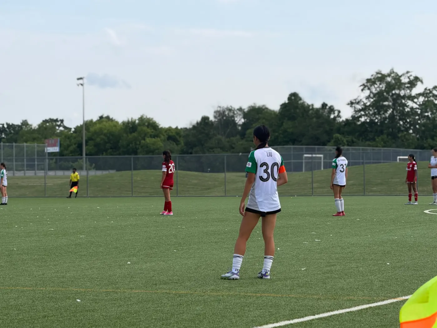Angelina wearing number 30 and a captain's armband during a match