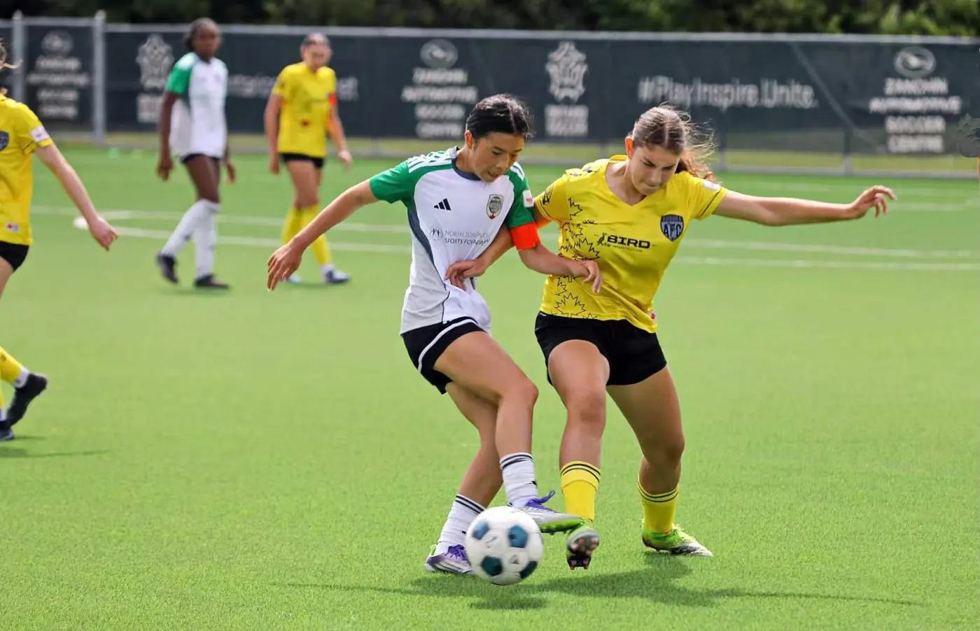 Angelina competing for the ball in a one-on-one duel